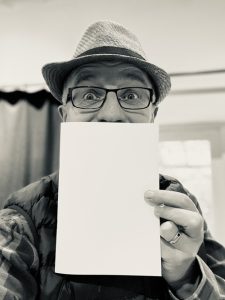 Richard Coan with 'ours' poetry book