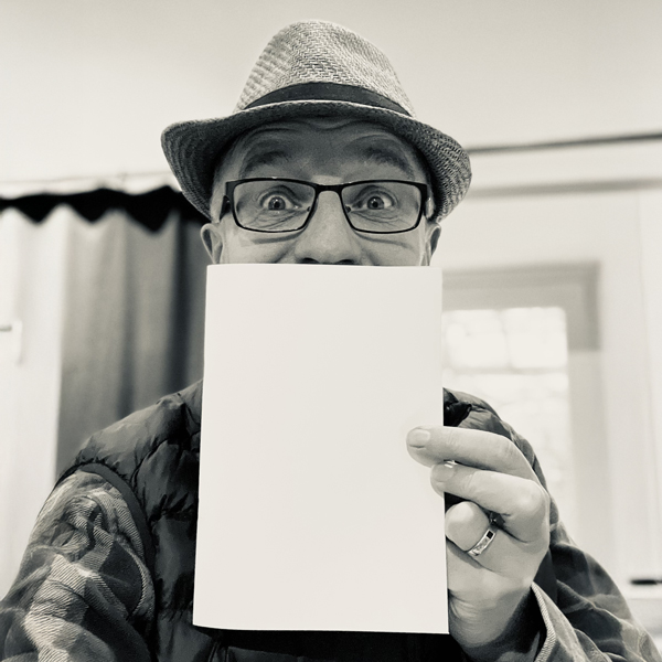 Richard Coan with 'ours' poetry book