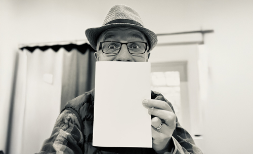 Richard Coan with 'ours' poetry book